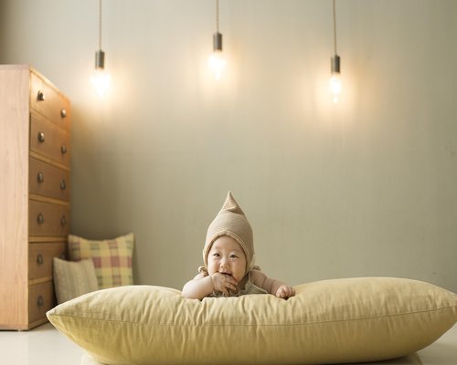 A cozy bedroom setting with warm soft lighting